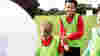 Volunteering with young children providing sports 